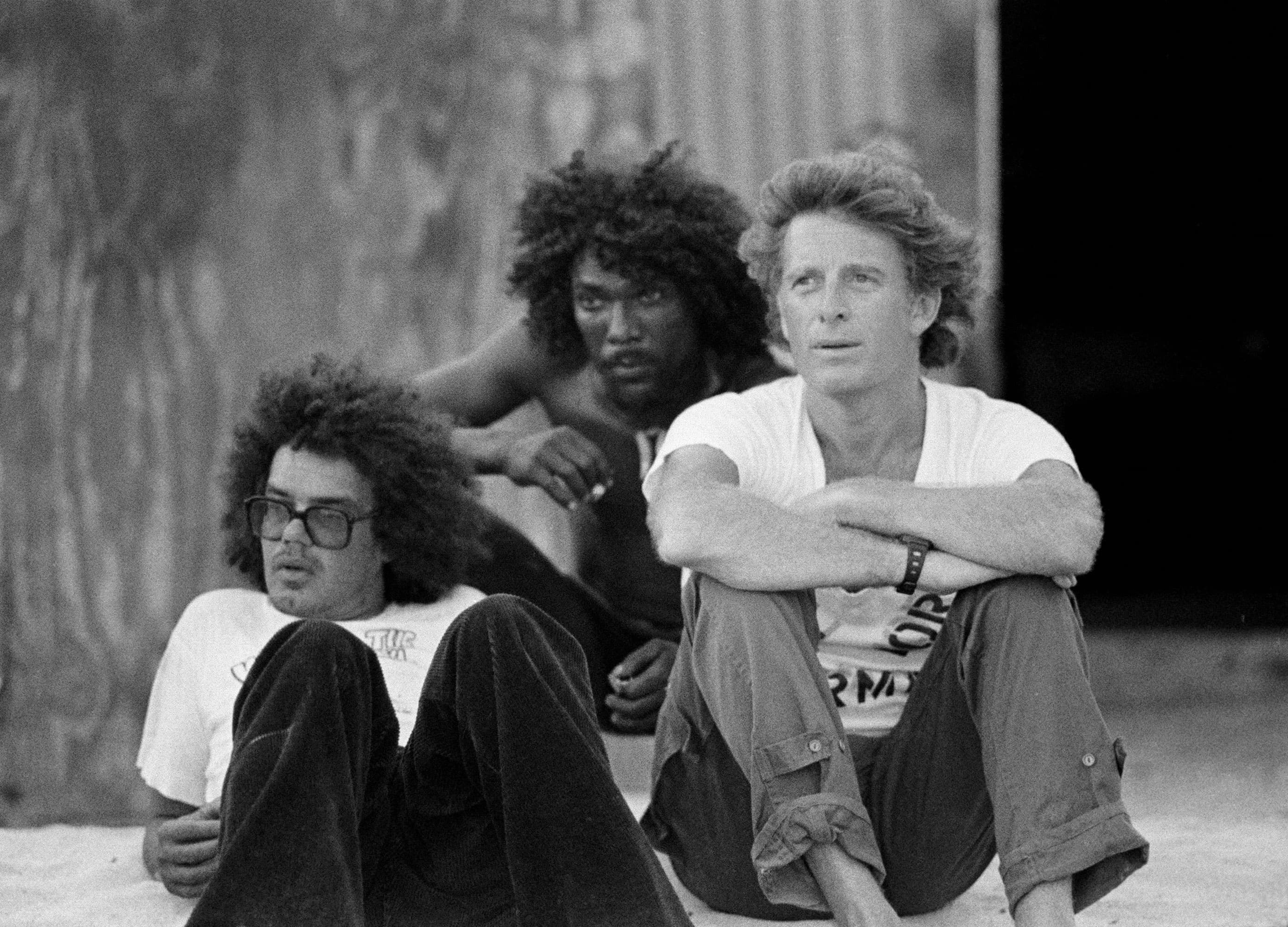(left to right) Dickie Jackson, Countryman, and Chris Blackwell on the set of the film Countryman in Jamaica. Photo by Nathalie Delon and courtesy of <i>The Story of Island Records: Keep On Running,</i> published by Universe Books, 2010.